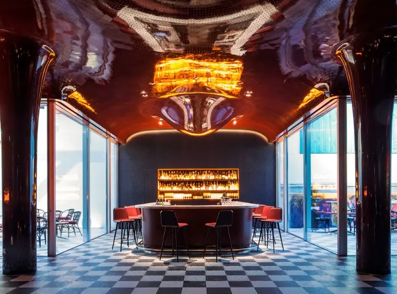 The bar at Les Bains Paris and its checkerboard floor